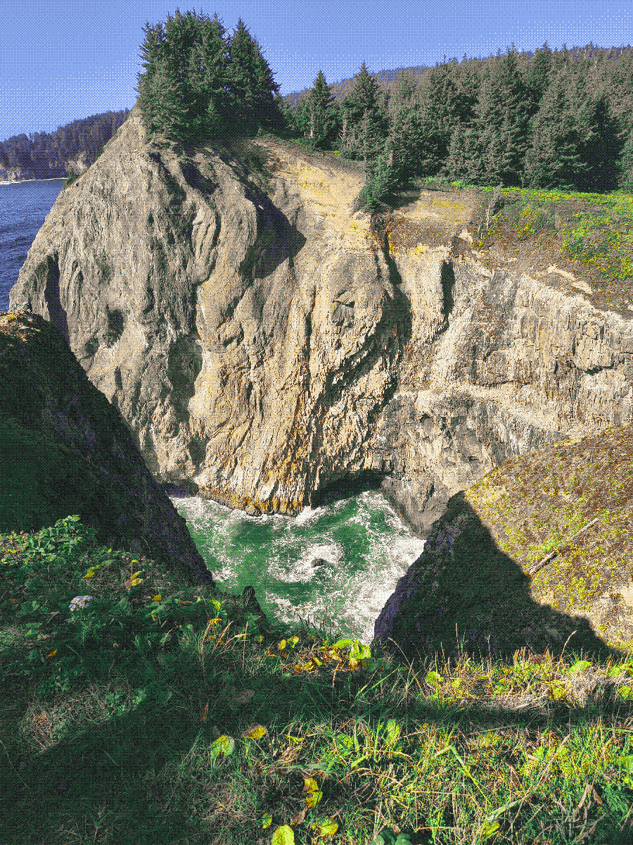 a view of the ocean and a cliffside