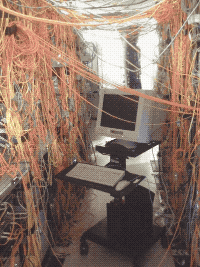 computer surrounded by cables